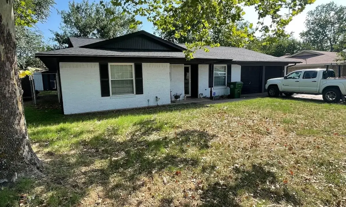 Professional roofing crew working on a residential roof in Nantucket